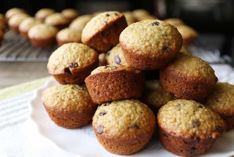 a pile of chocolate chip banana muffins on a plate