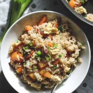 a white bowl with bacon fried rice