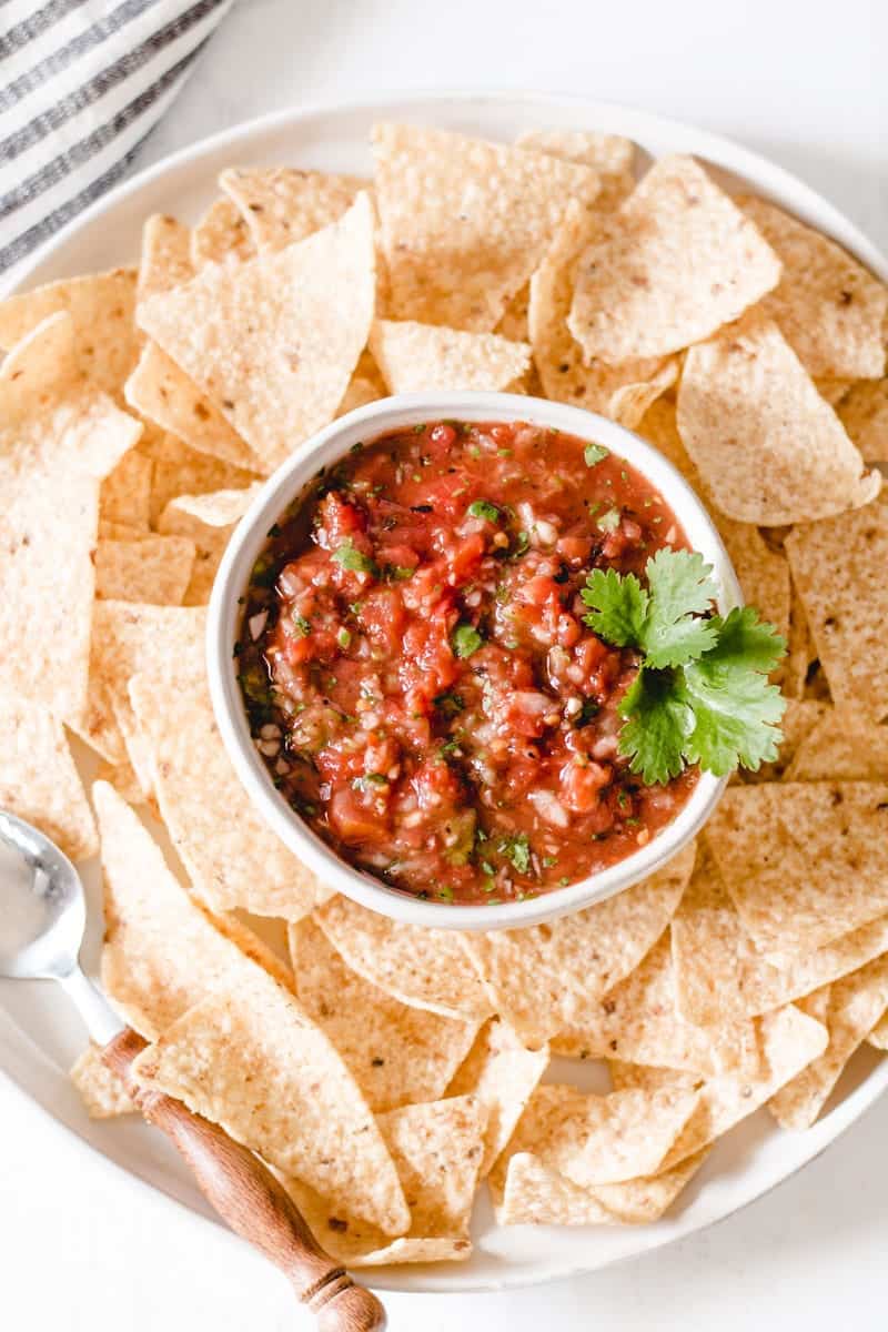 Chipotle salsa in a bowl surrounded by chips.