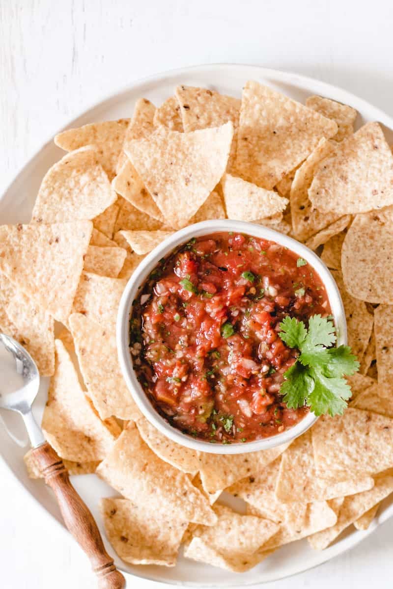 Chipotle salsa in a bowl surrounded by chips.
