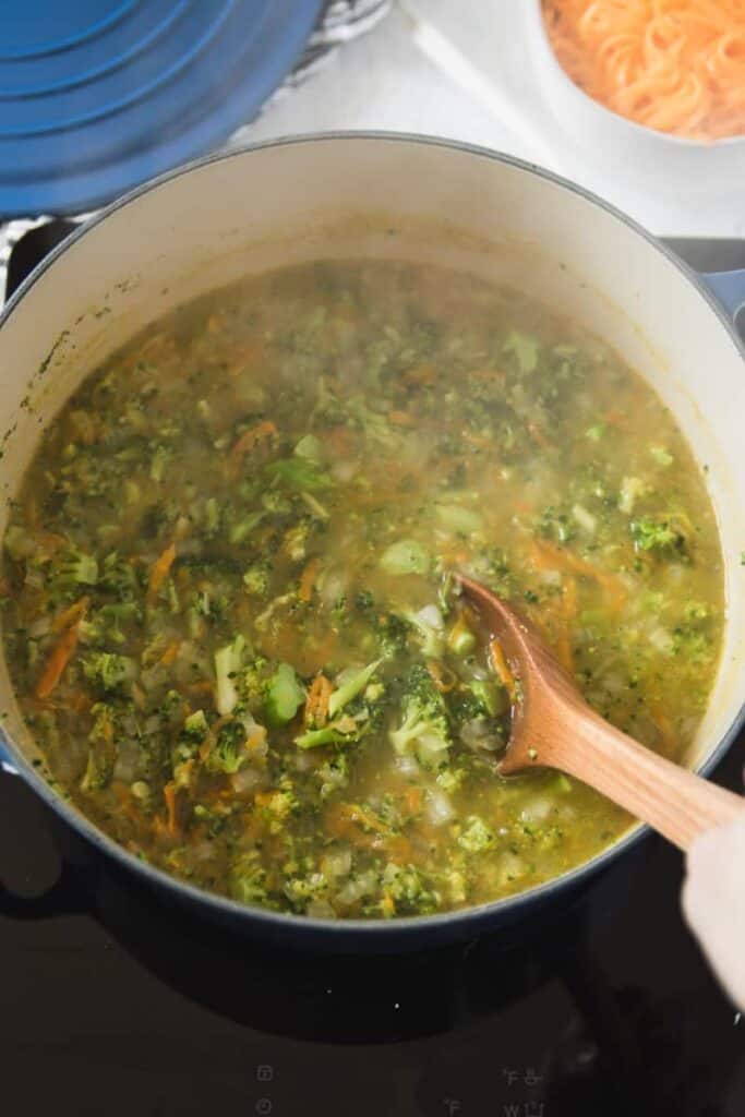 The simmered soup with the broccoli cooked down.