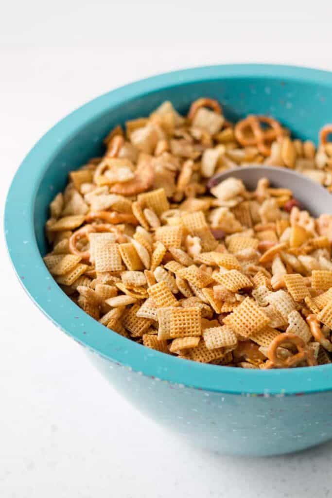 Gluten-free chex mix in a large Zak blue confetti bowl.