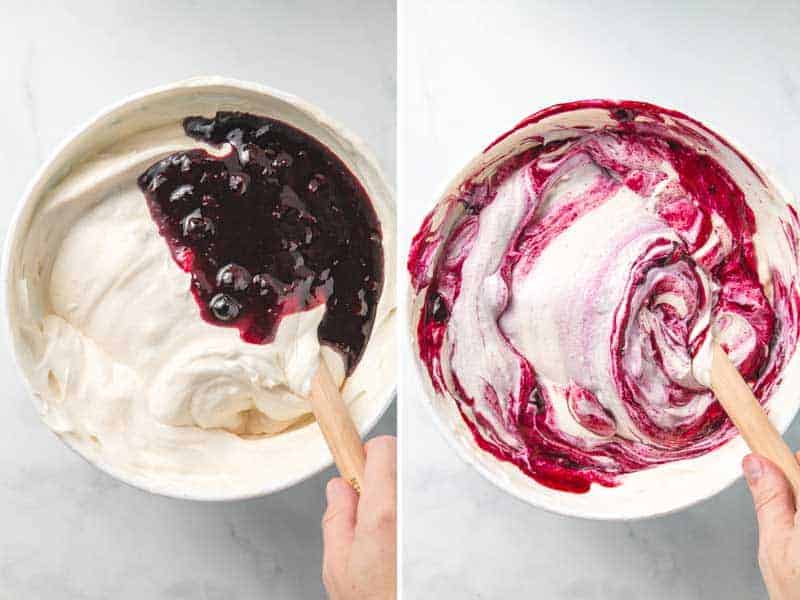 Blueberry sauce is folded into the ice cream base, leaving vibrant purple swirls in the bowl.