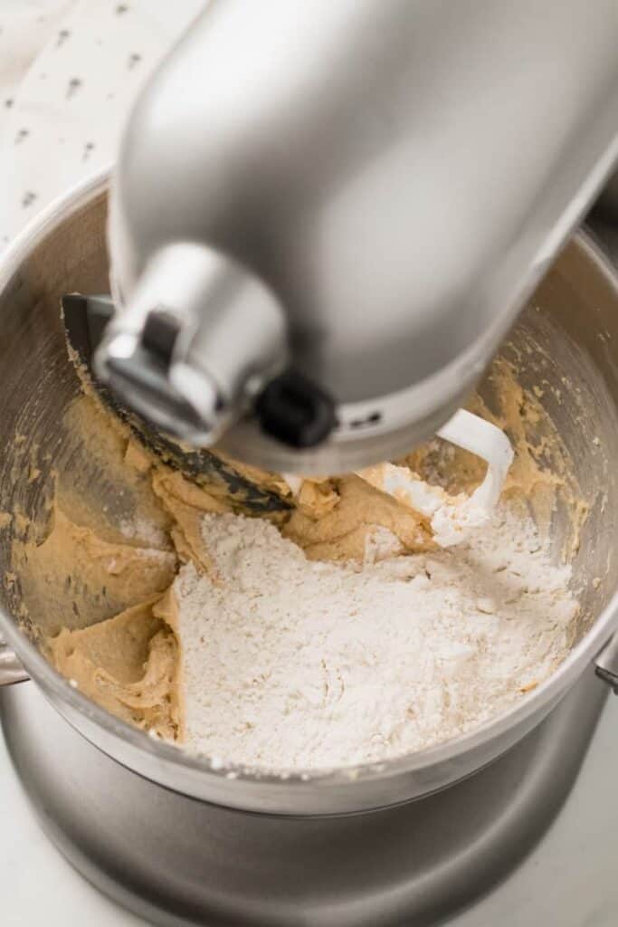 Flour mixture on top of creamed wet ingredients in a stand mixer.