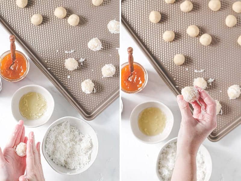 Rolling thumbprint dough between the palms of hands after rolling in egg white and coconut.