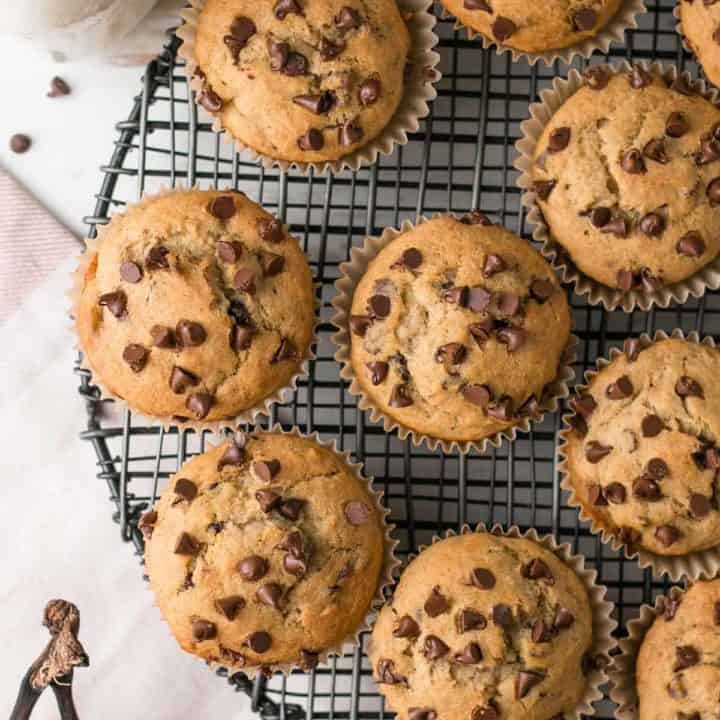 gluten-free chocolate chip banana muffins on black wire rack.