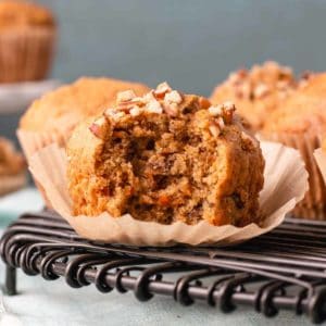 Gluten-free carrot muffin with bite taken to reveal texture.
