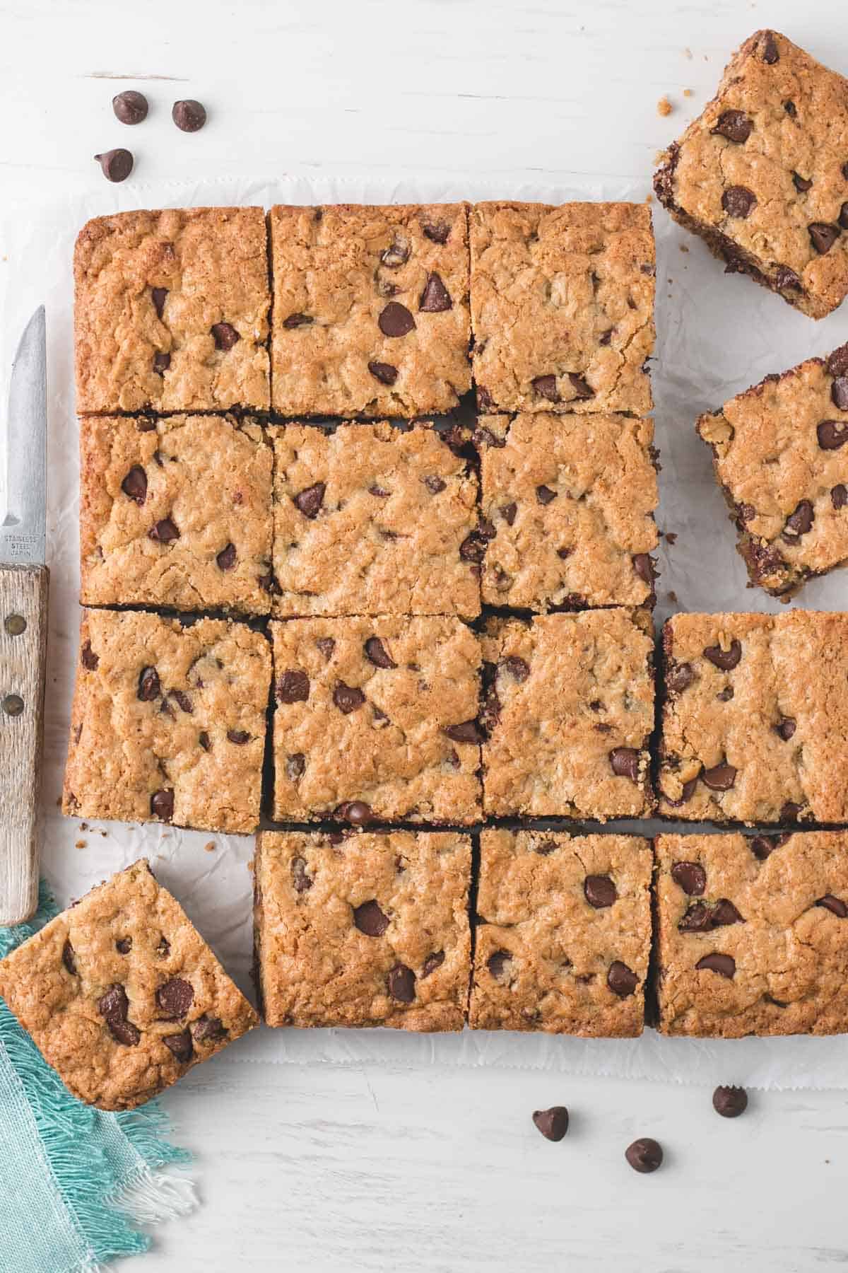 A batch of Gluten-free Oatmeal Chocolate Chip Bars cut into squares.