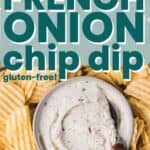 Gluten-free French onion chip dip in a small bowl next to wavy potato chips.