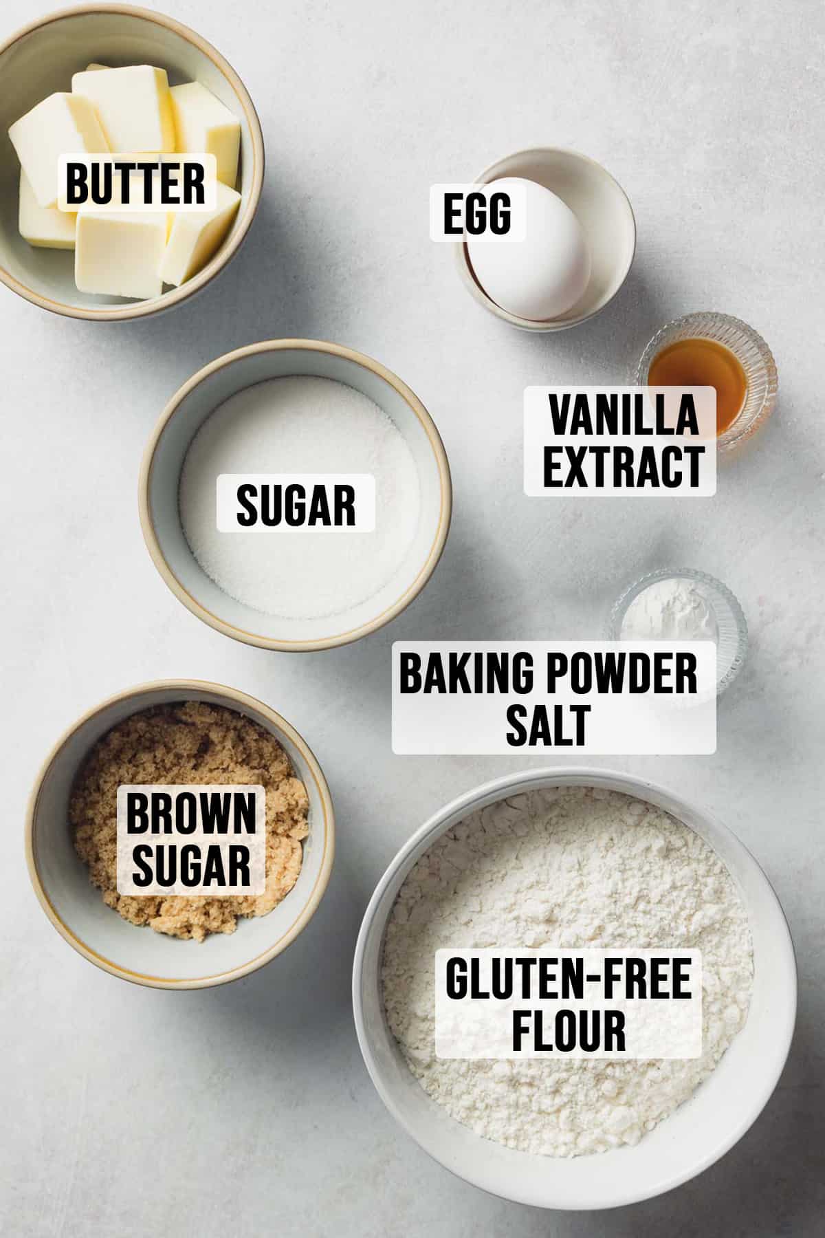 Ingredients for gluten free sugar cookies measured out in bowls.