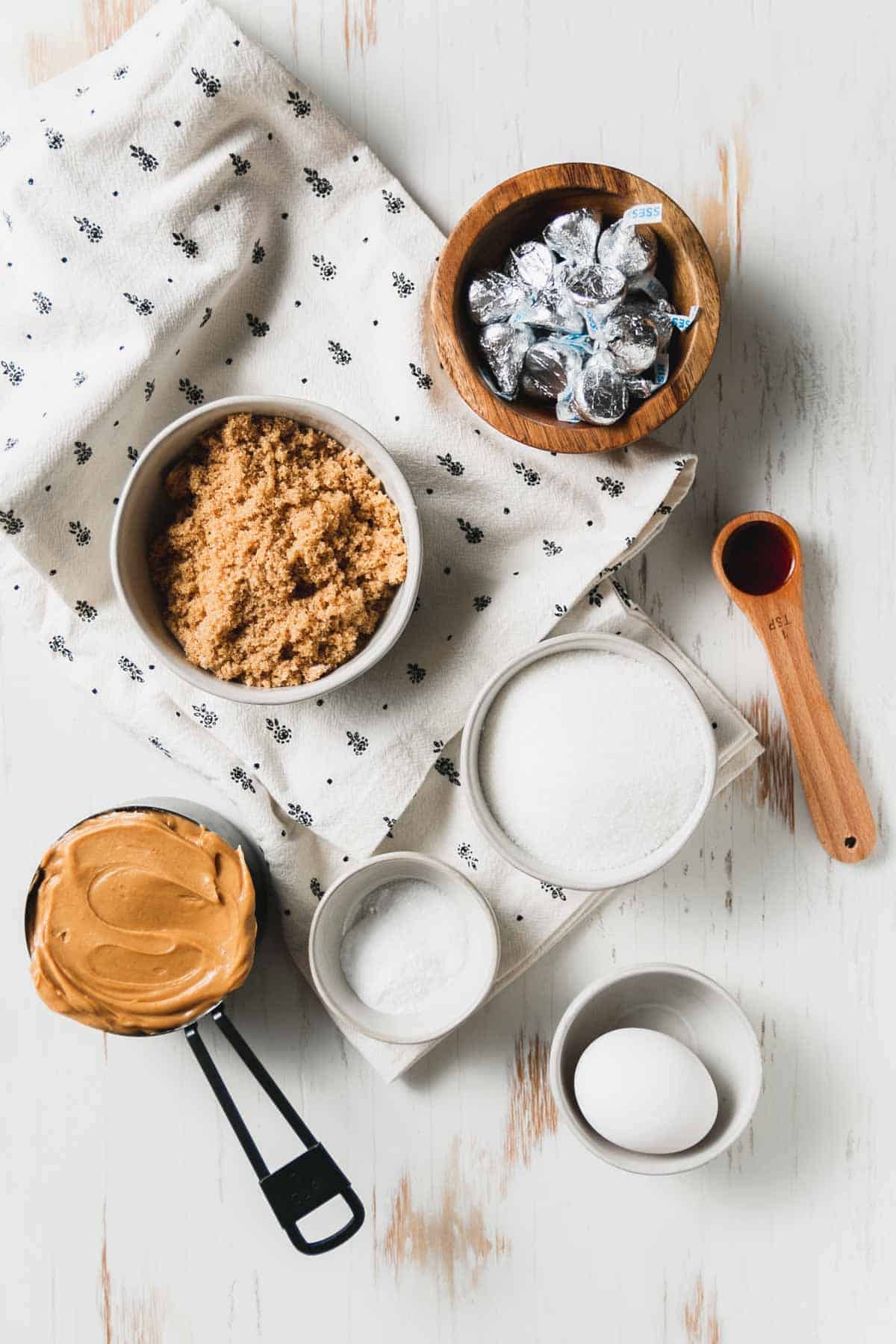 Ingredients for flourless pb blossoms measured out in bowls.