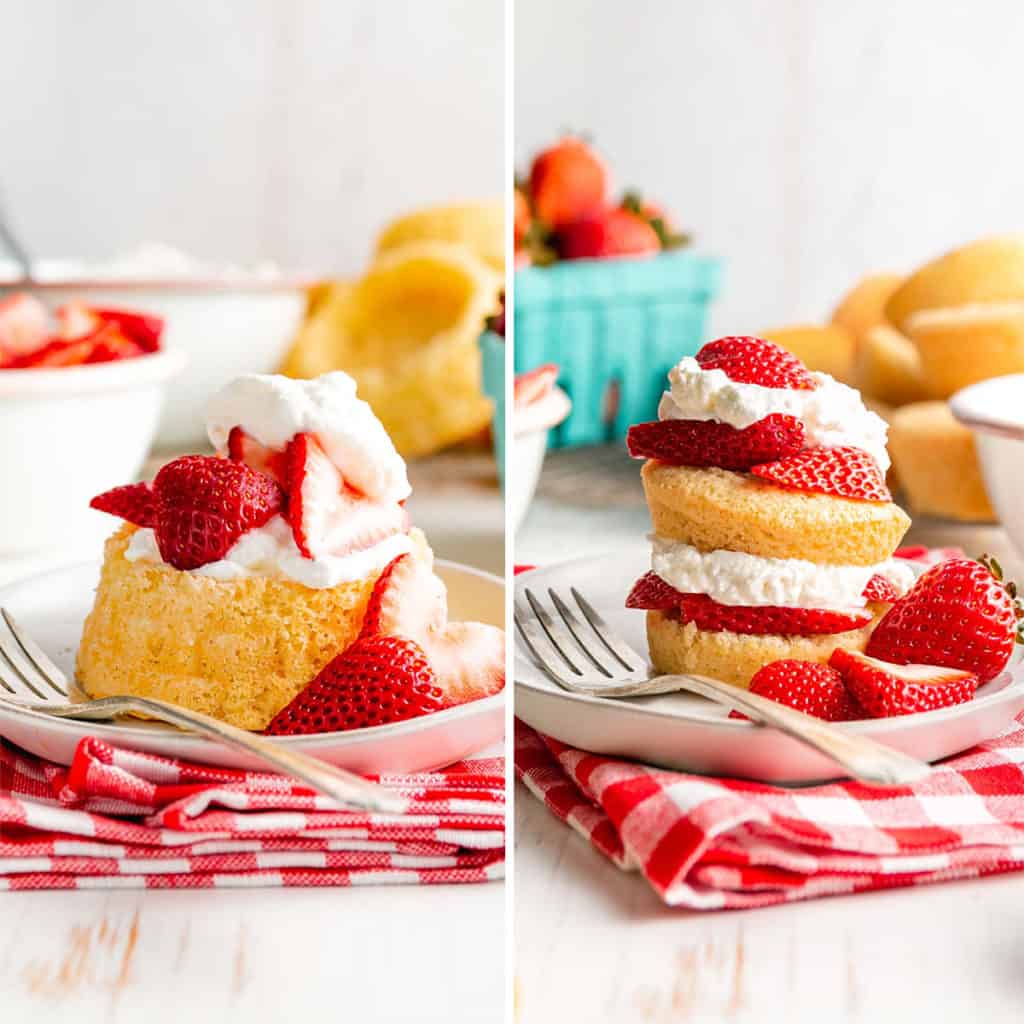 Strawberry shortcakes layered with whipped cream and sliced strawberries on red checked napkin.