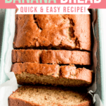 A loaf of gluten free zucchini banana bread in a light green speckled loaf pan.