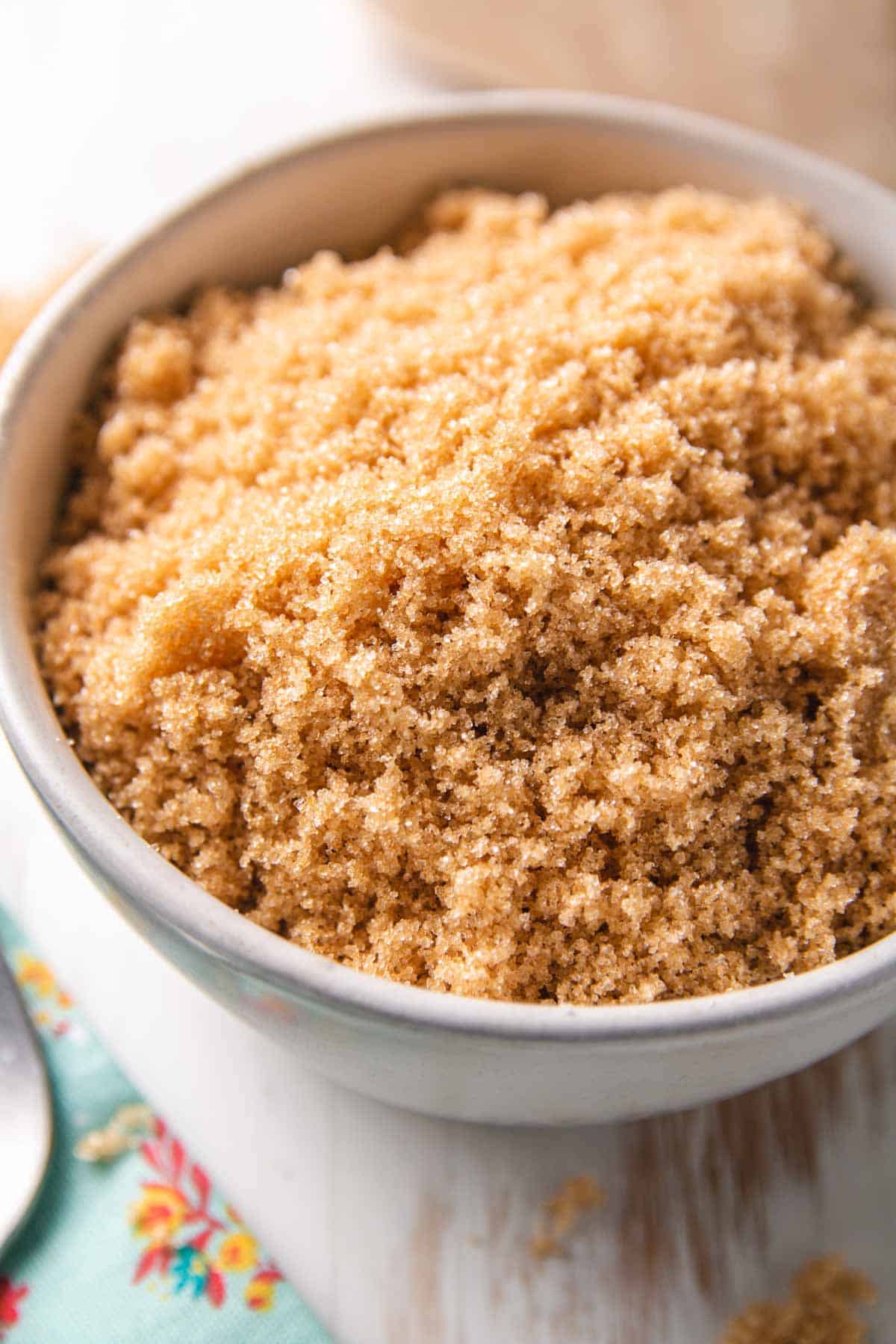 Close up of a small bowl filled with brown sugar.