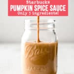 A stream of copycat Starbucks pumpkin spice sauce pouring into a mason jar.