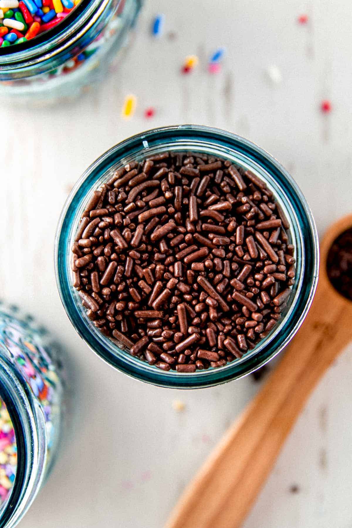 Overhead view of a jar filled with chocolate jimmies.