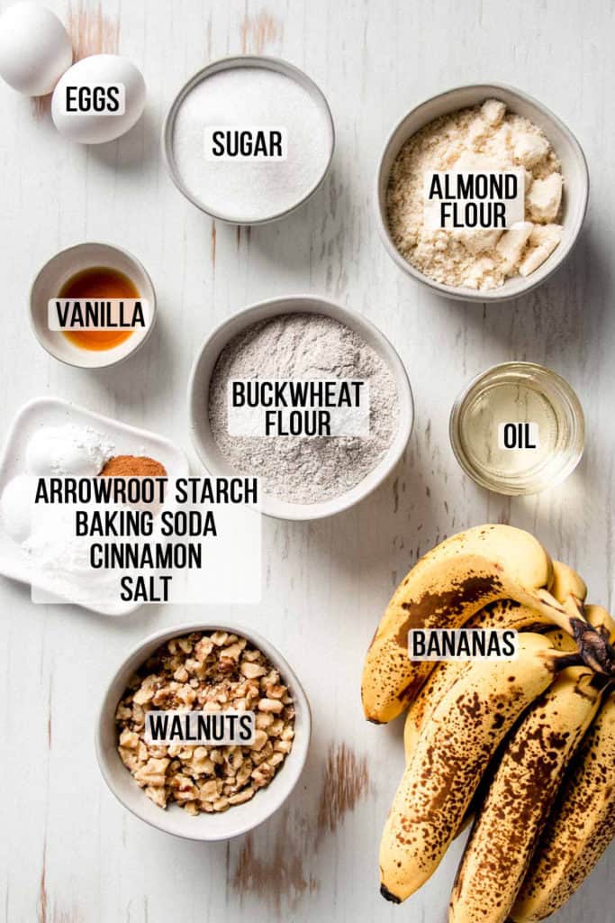 Buckwheat banana bread ingredients measured out in bowls. 