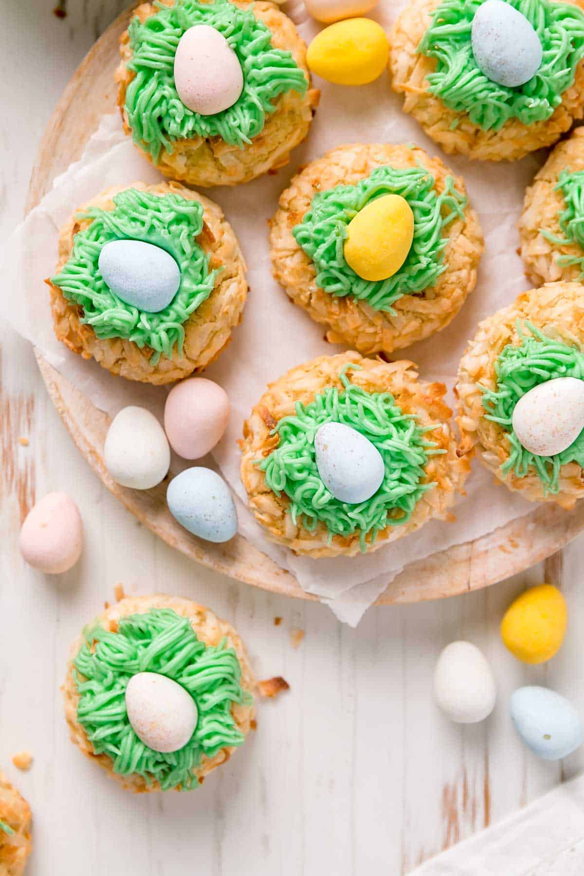 Wooden plate with easter thumbprints topped with Cadbury mini eggs.