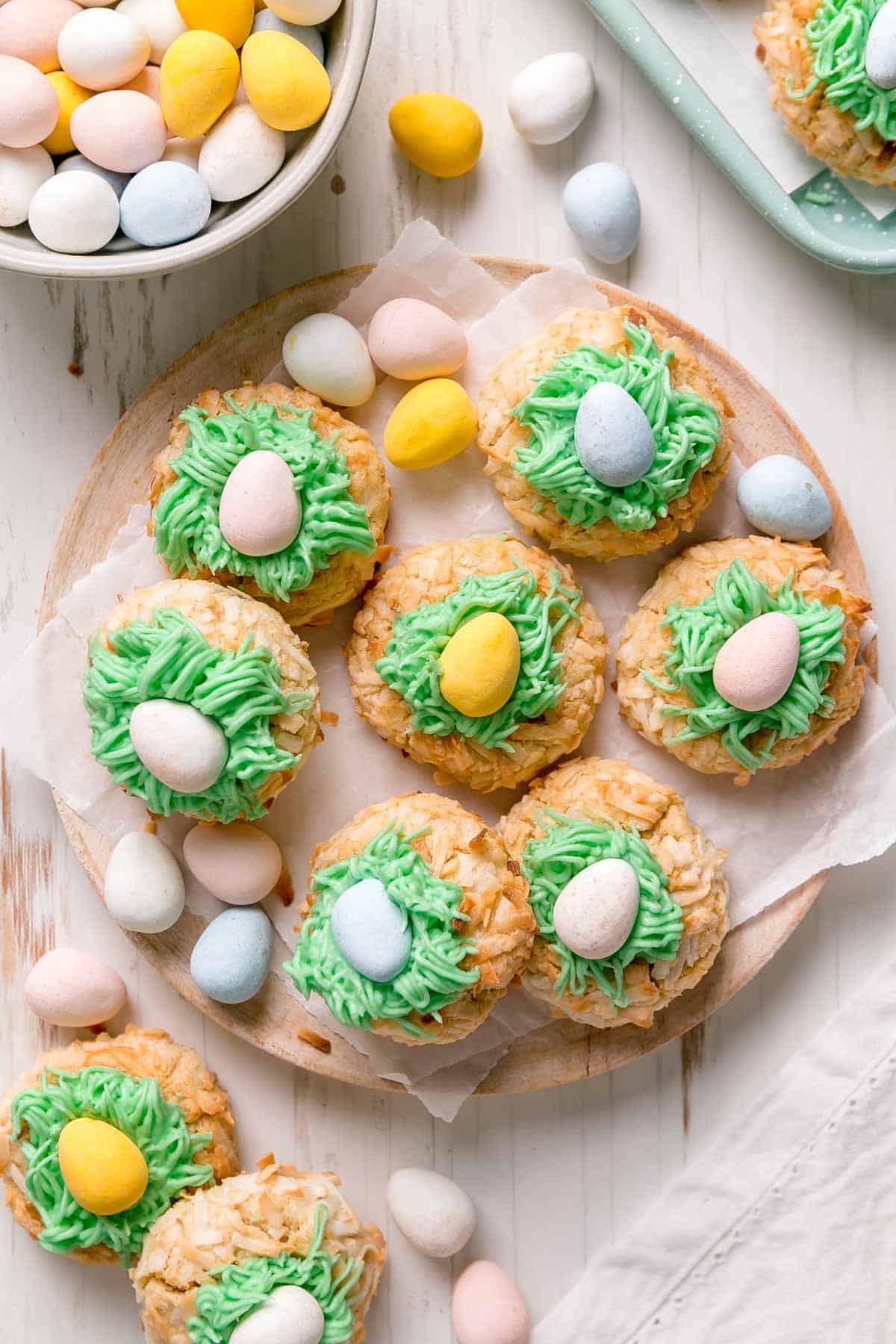 A tray of gluten free Easter themed thumbprint cookies with Cadbury egg on top.