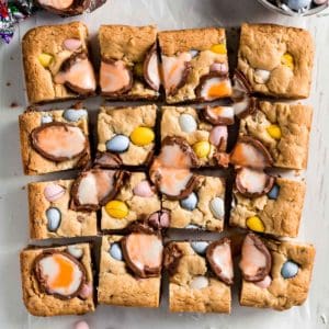 Gluten free easter cookie bars with Cadbury eggs cut into squares.