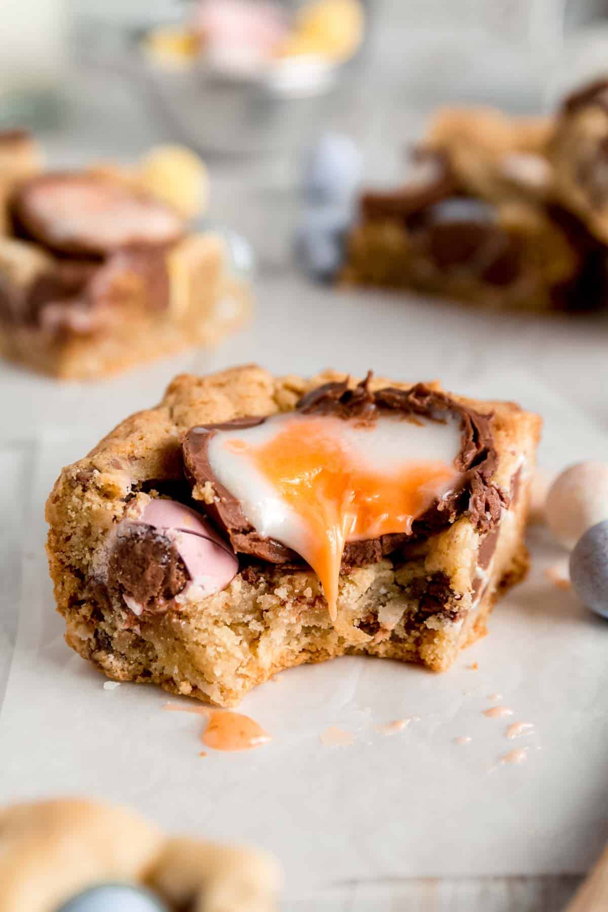 A cookie bar with Cadbury creme egg center dripping down the side.