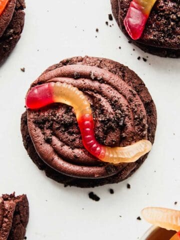 Gluten-Free Oreo Dirt Cake Cookie with a gummy worm on top.