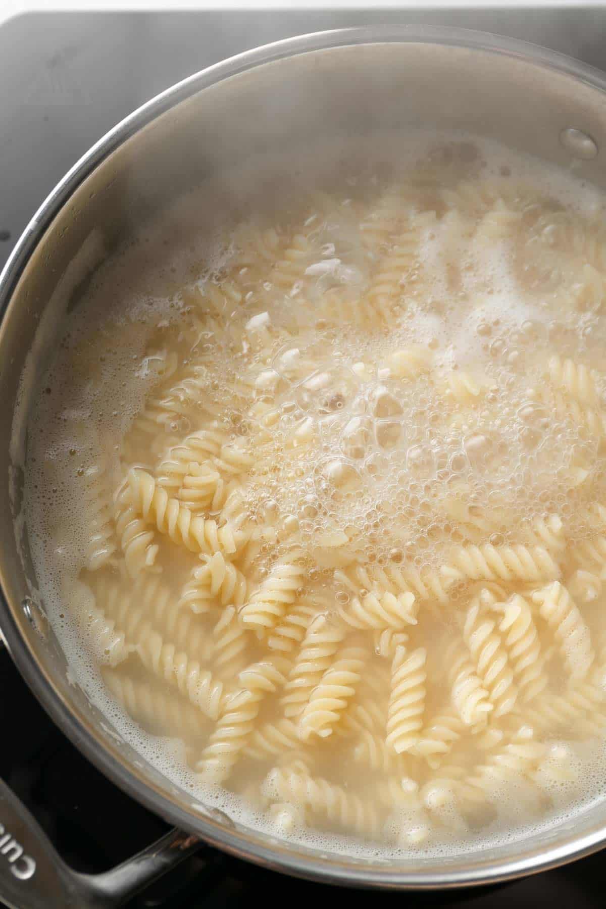 Pasta boiling in a pot of water.