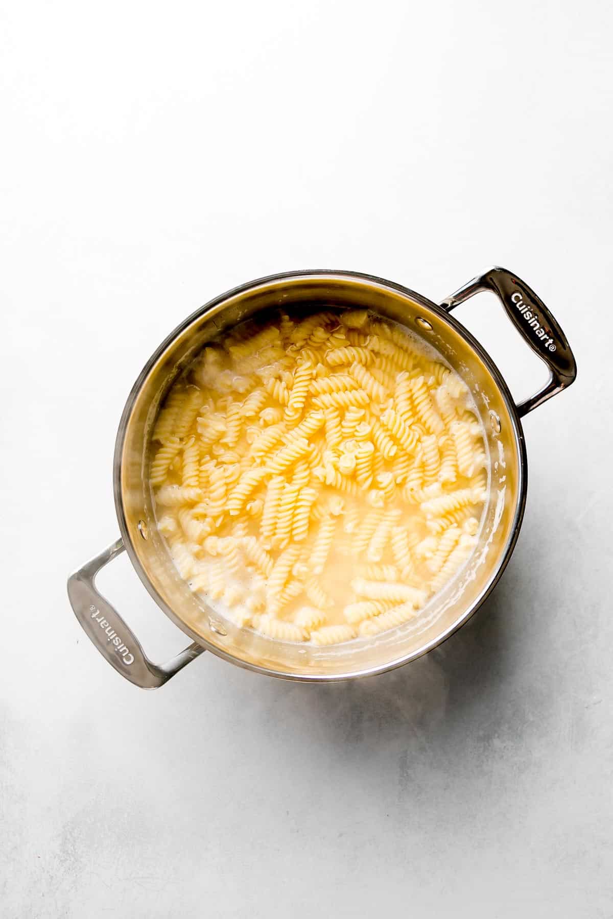 Gluten free pasta in pot of water.