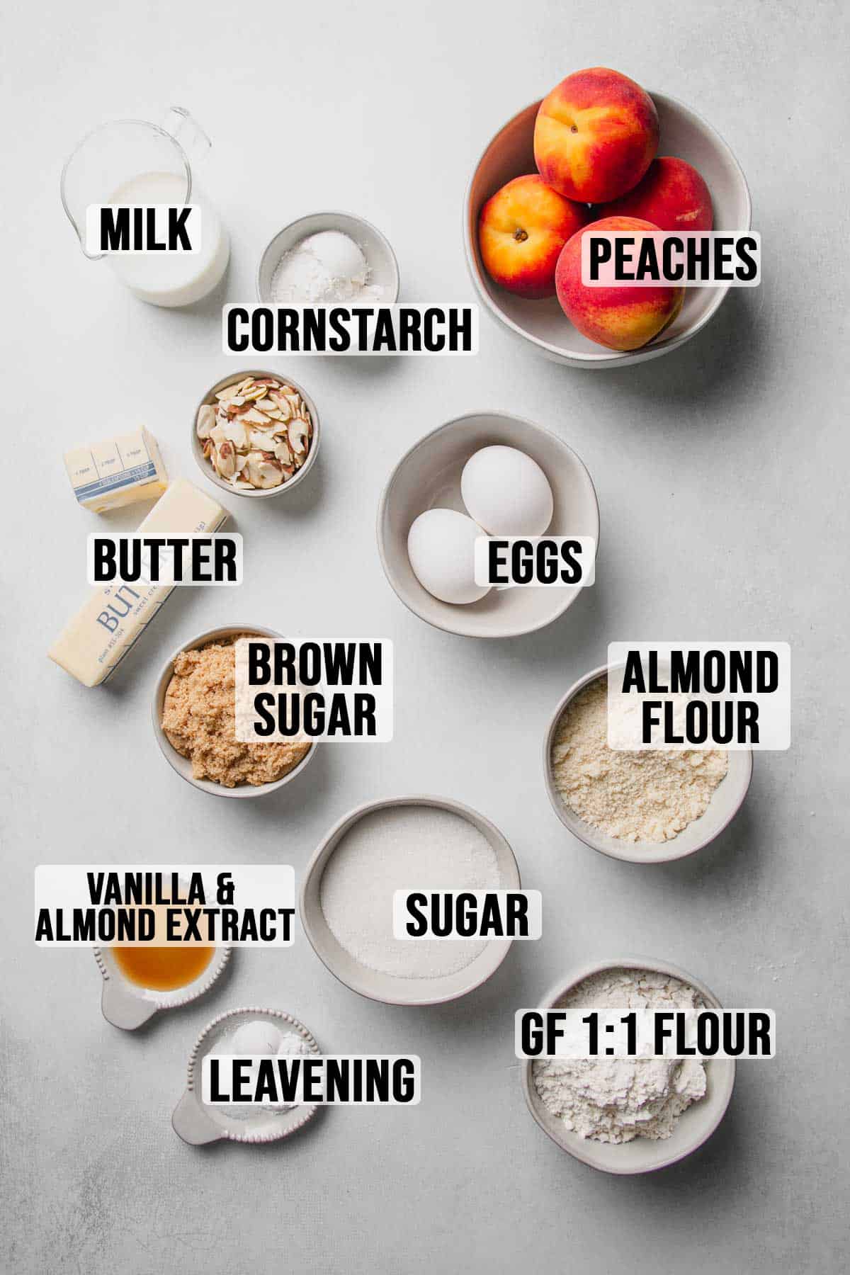 Ingredients for gluten-free peach cake measured out in bowls.