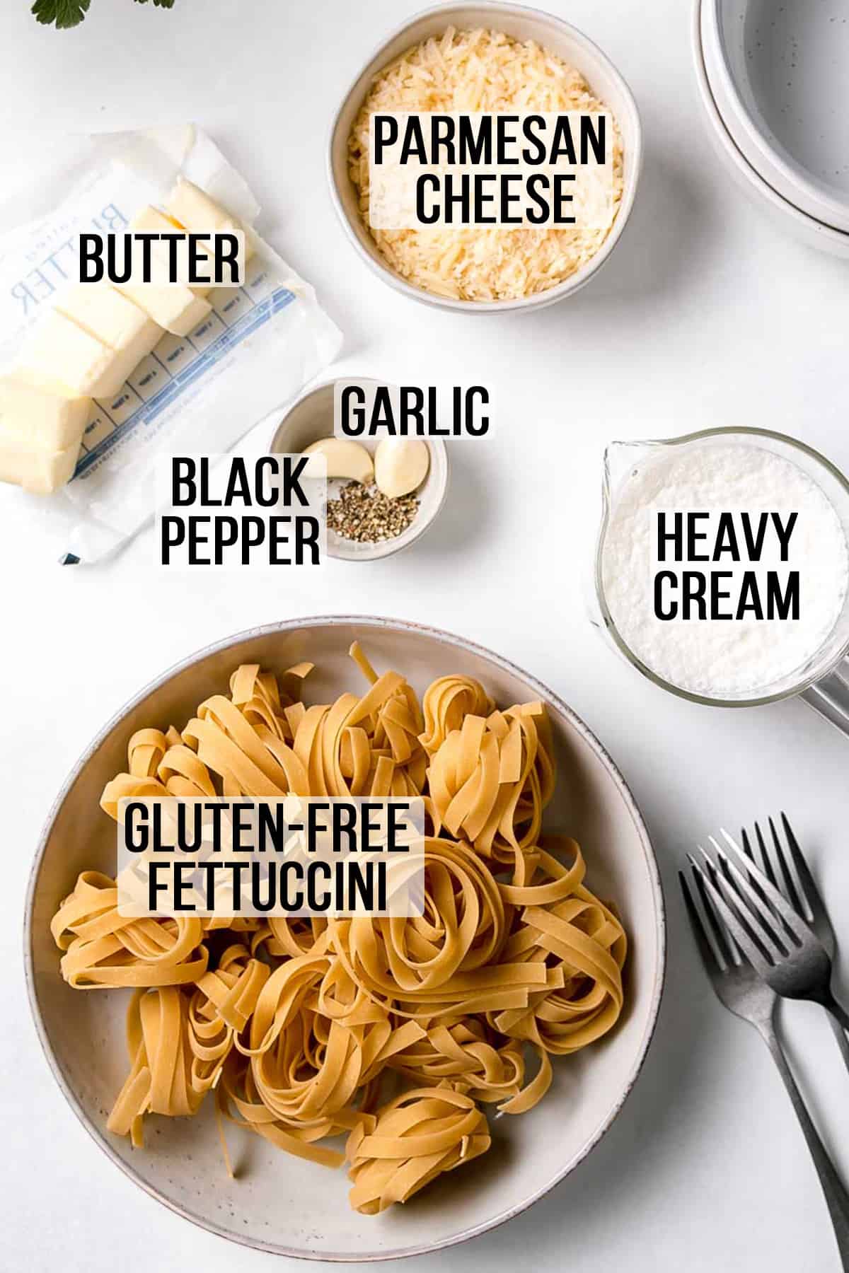 Ingredients for gluten free fettuccini Alfredo measured out in bowls.