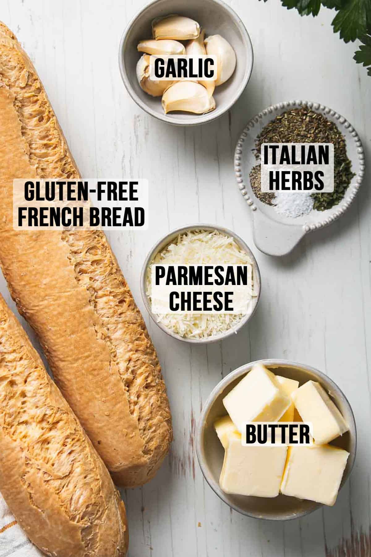 Ingredients for gluten-free garlic bread measured out in bowls.