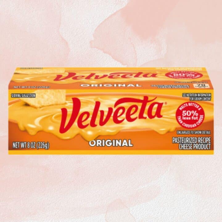 Velveeta package on pink background.