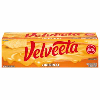 Velveeta cheese block with red and orange packaging.