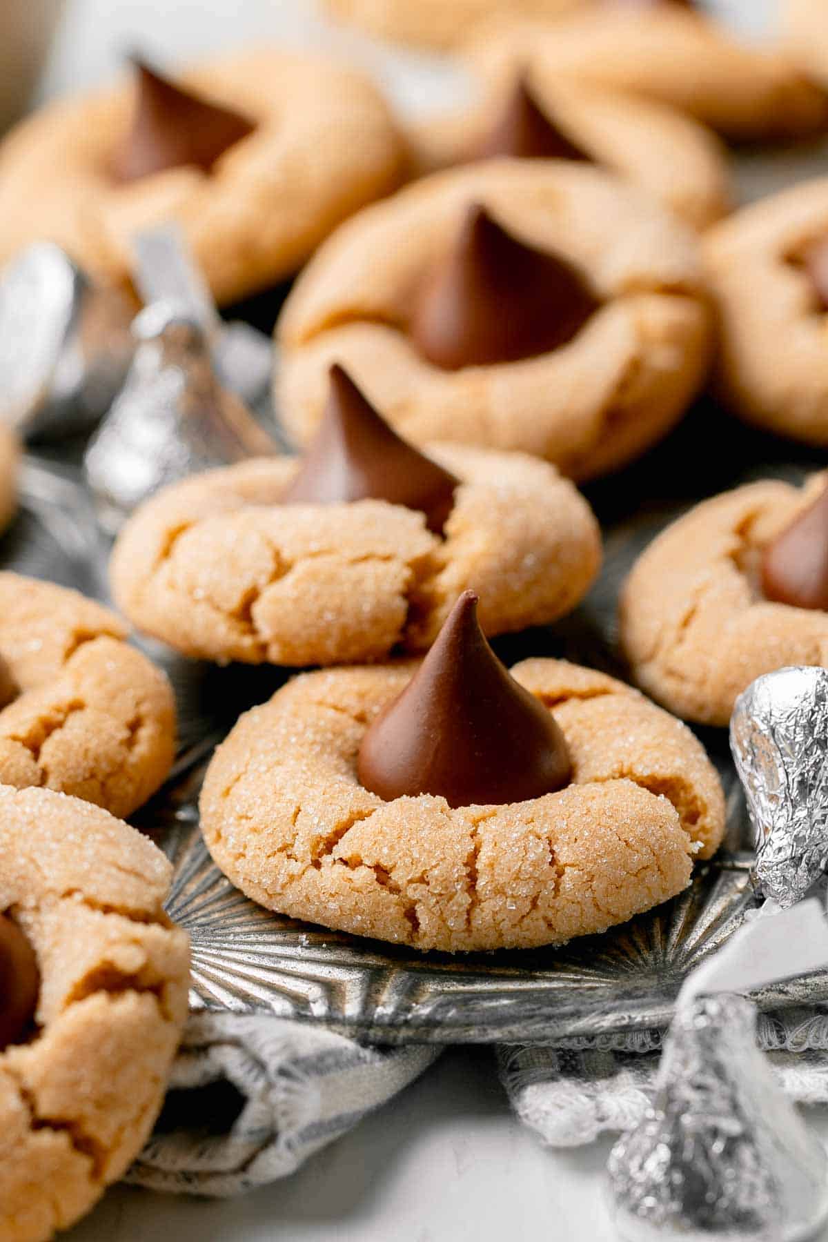 Gluten free peanut butter blossoms on a vintage metal tray. 