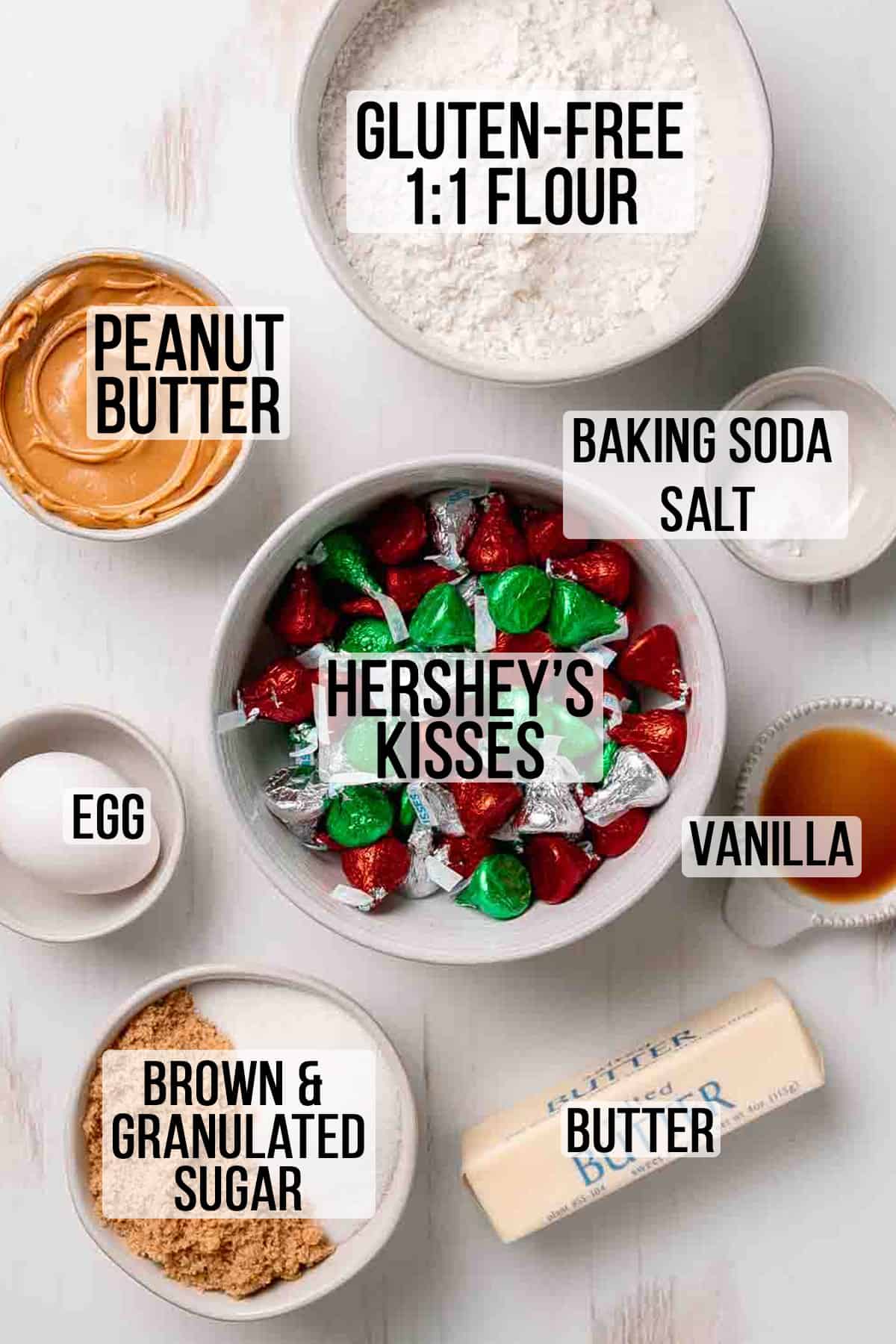 Ingredients for gluten free peanut butter blossoms measured out in bowls.