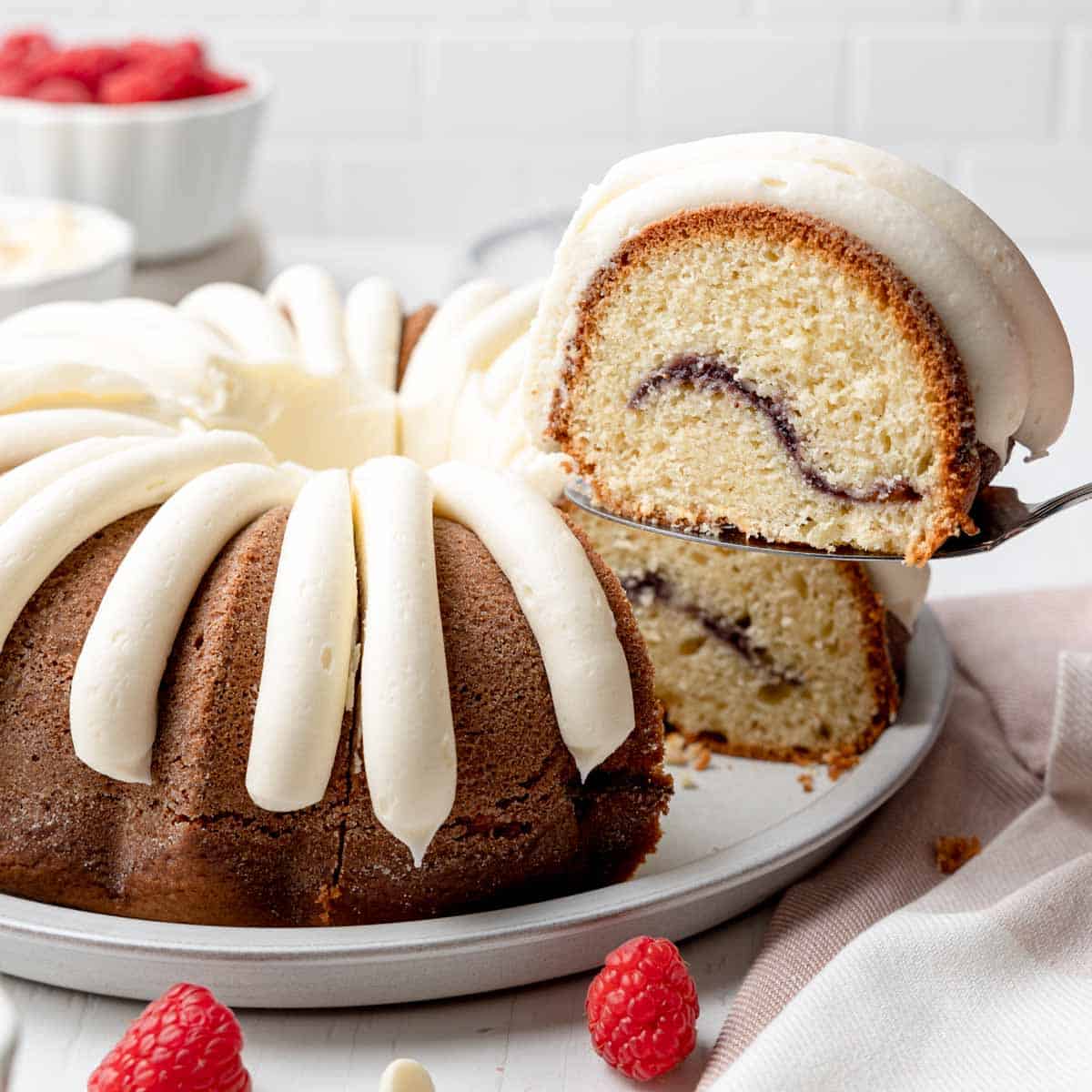 https://wheatbythewayside.com/wp-content/uploads/2023/02/Gluten-Free-White-Chocolate-Raspberry-Bundt-Cake-FI.jpg