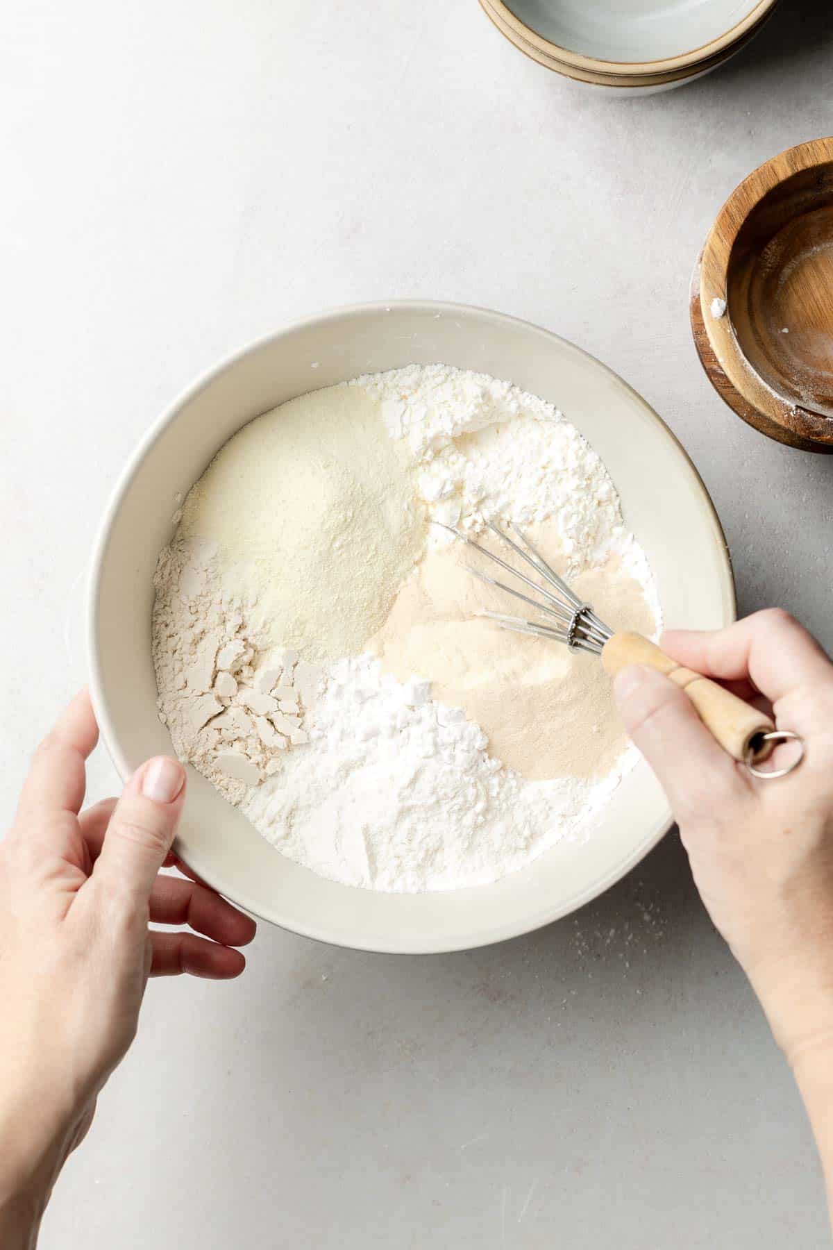 Ingredients in a large mixing bowl with whisk.