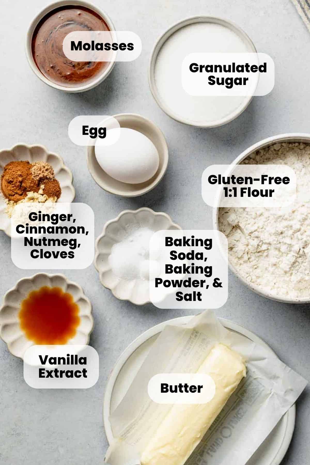Ingredients for gluten free ginger molasses cookies measured out in bowls.