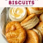 Round gluten free biscuits in bowl next to honey butter.