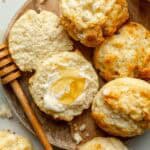 Open face gluten-free drop biscuit slathered with butter and honey.