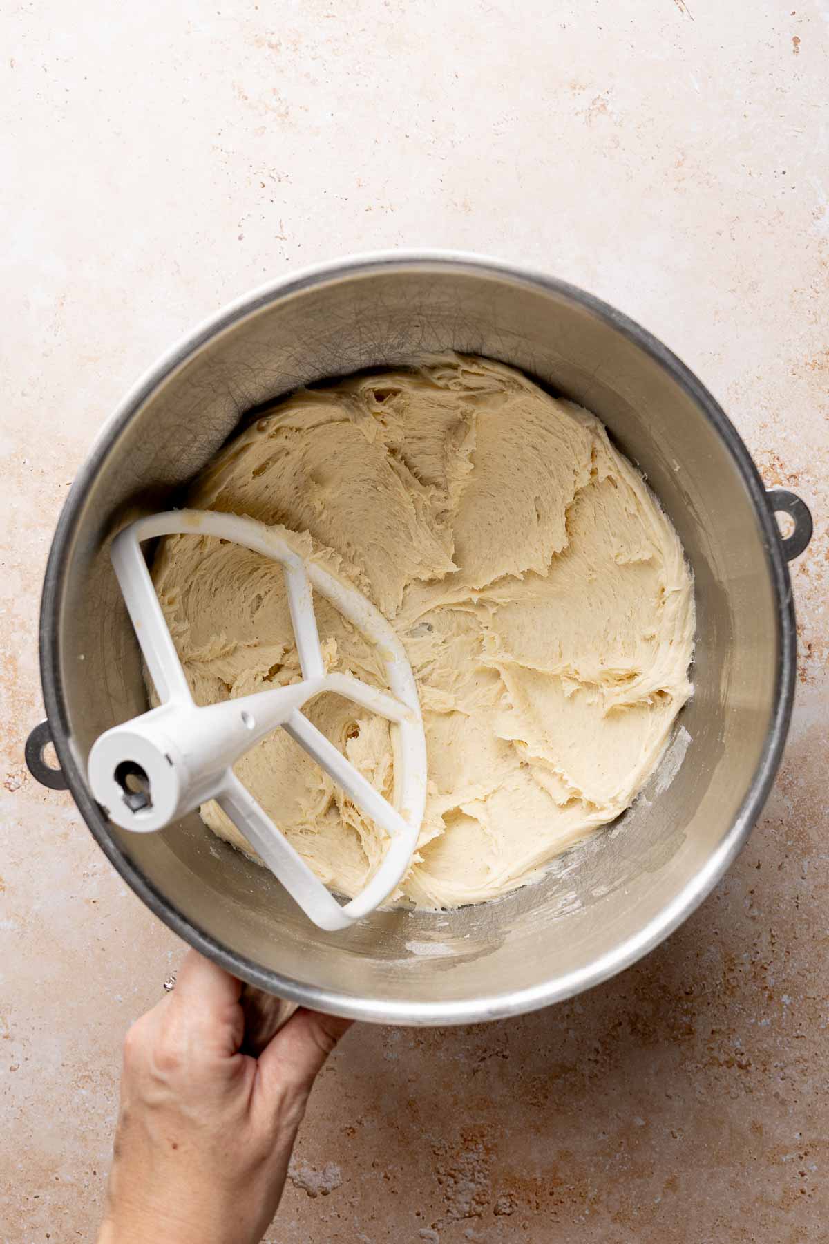 Mixing bowl with gluten-free crescent roll dough and paddle attachment.
