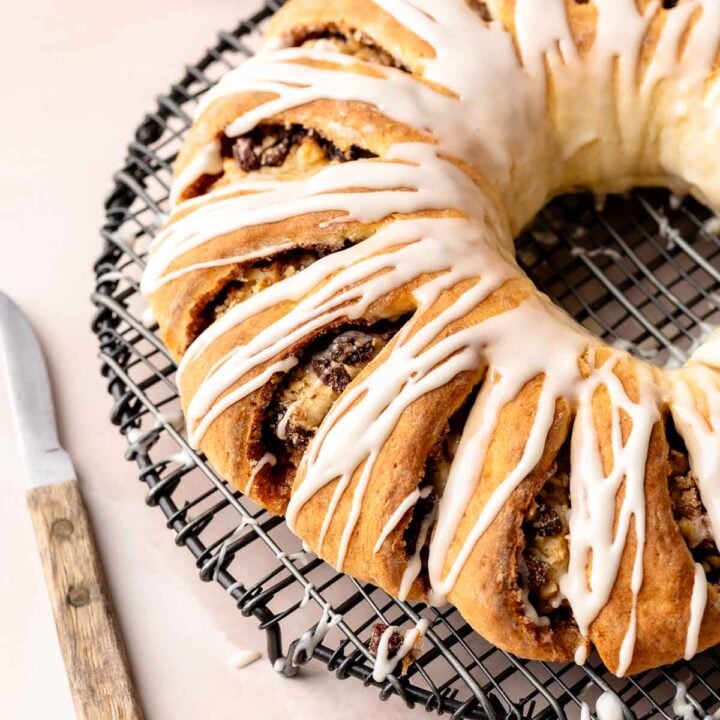 Iced gluten free Swedish tea ring cooling on a wire rack.
