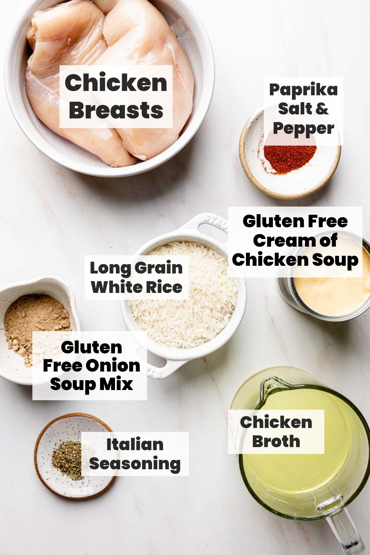 Chicken, rice, broth, cream soup, and spices all measured out in bowls.