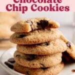 A stack of 5 almond flour chocolate chip cookies on small plate with one leaning to the side.