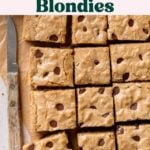 Gluten-free brown butter blondies cut into squares, placed on parchment paper.