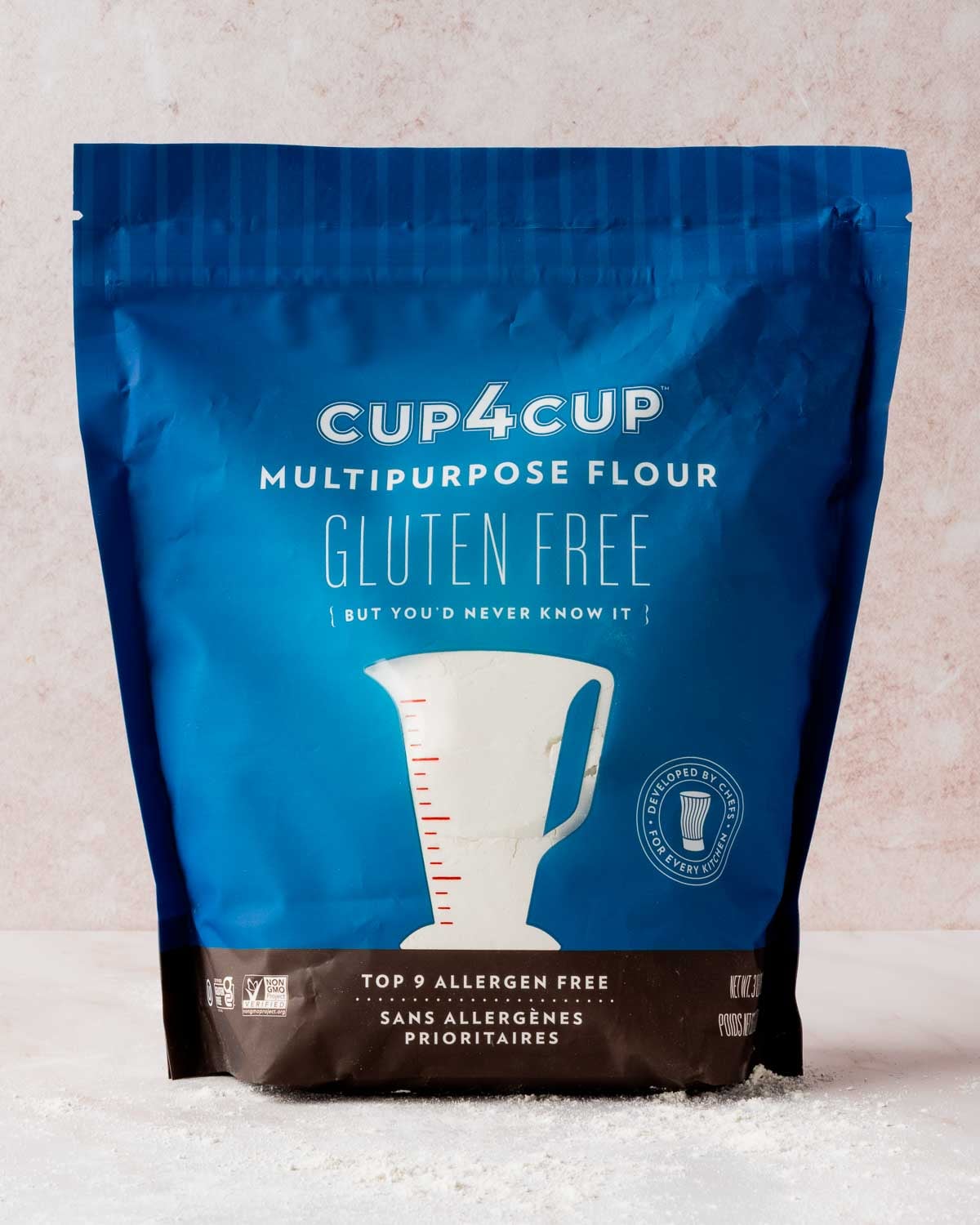 A bag of Cup4Cup resting on pink background.