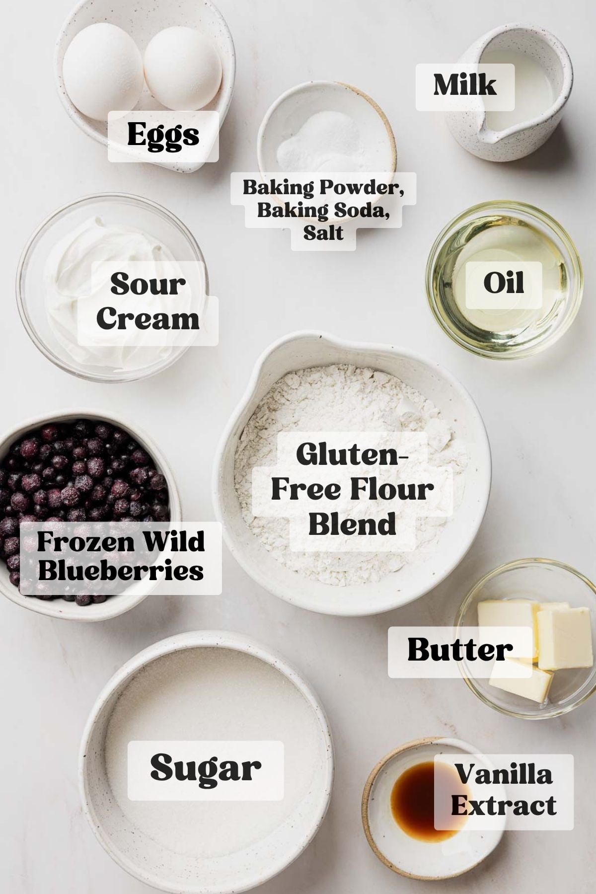 Ingredients needed for gluten-free blueberry muffins measured out in bowls.