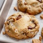 Gluten-Free S'mores Cookies cooling on parchment lined baking sheet.