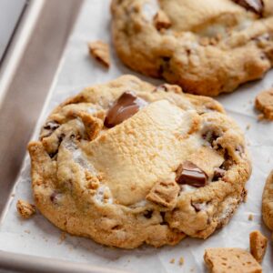 Gluten-Free S'mores Cookies cooling on parchment lined baking sheet.