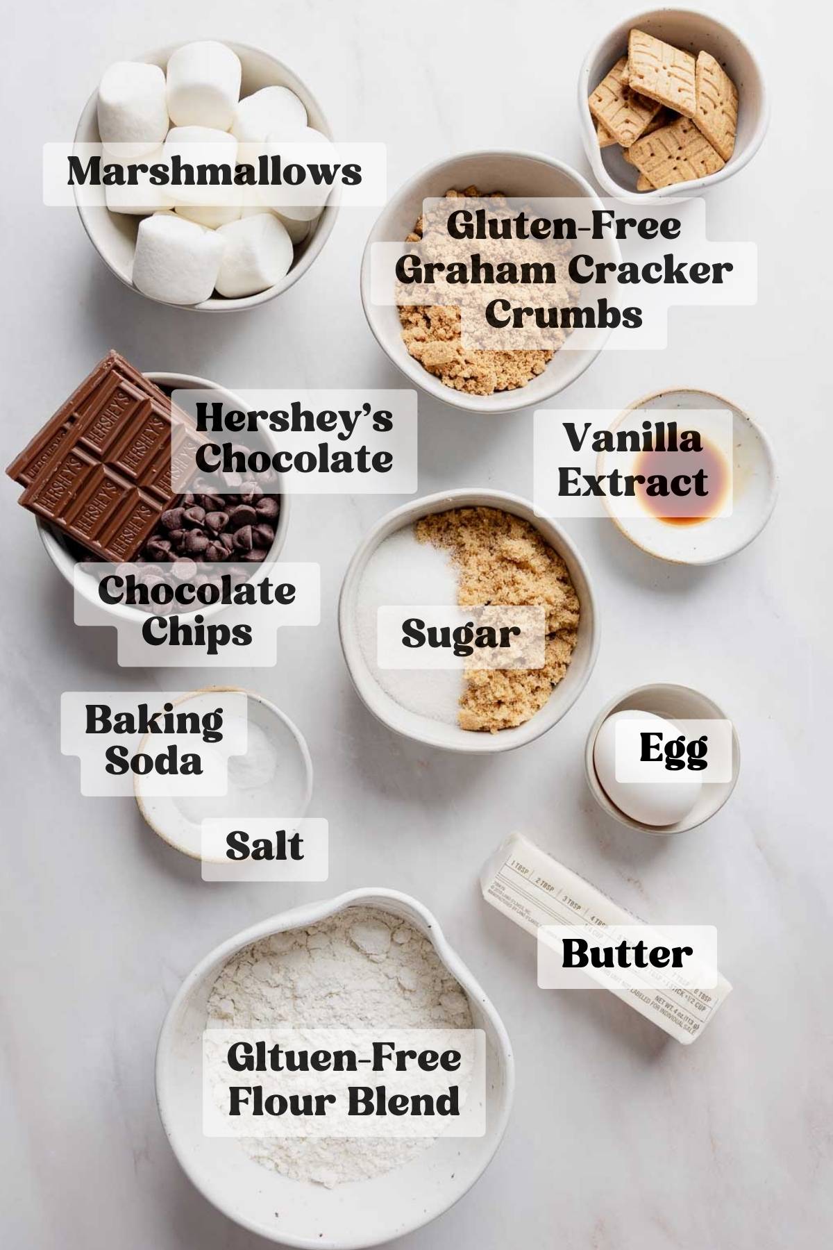 Ingredients for gluten free s'mores cookies measured out in bowls.